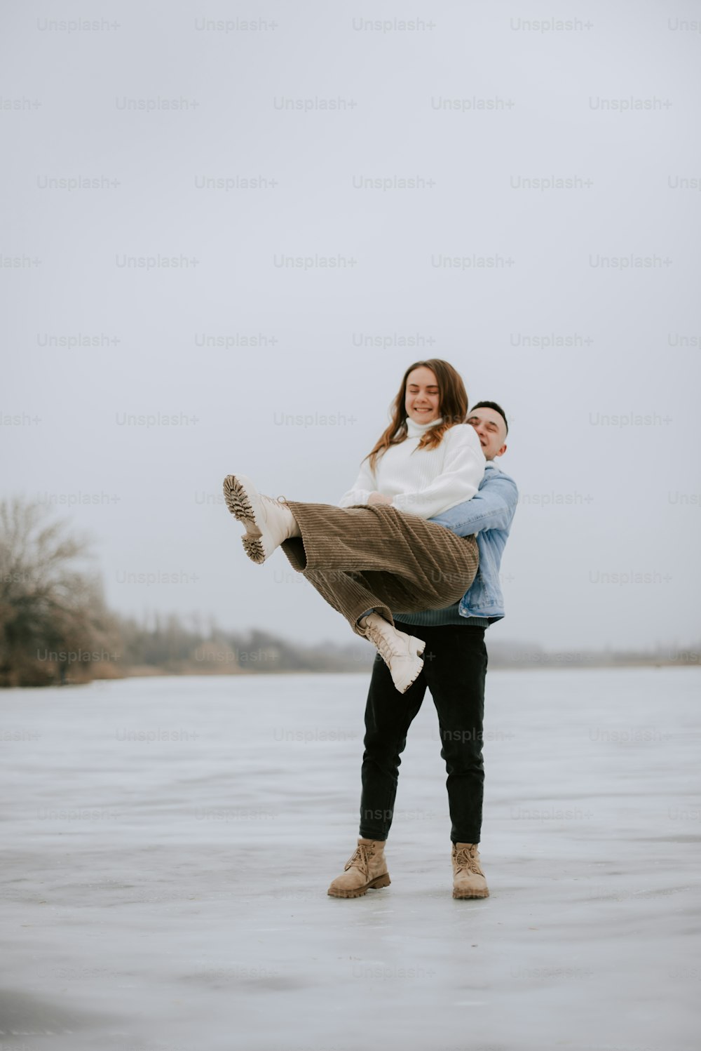 a man carrying a woman on his back