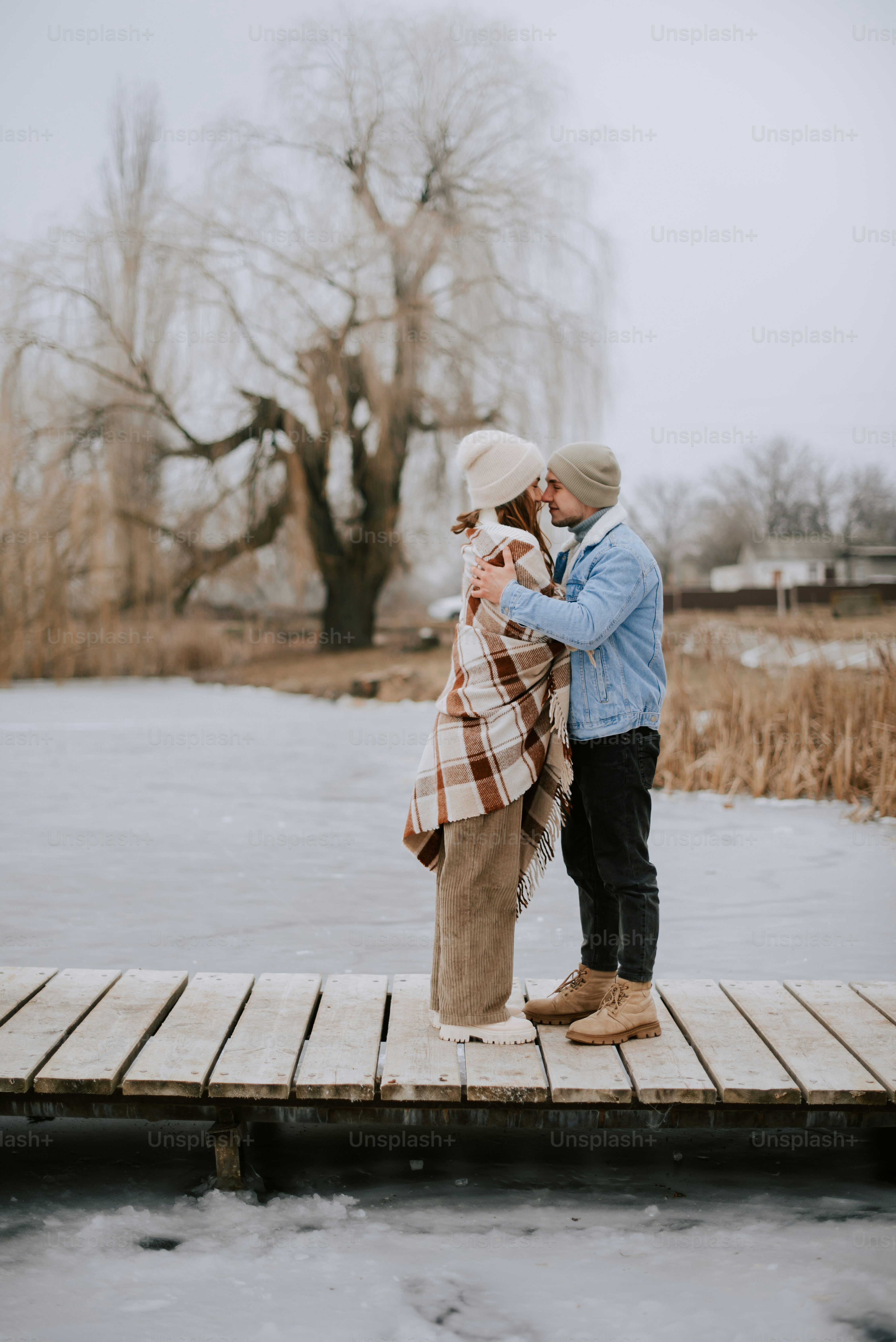 a man and a woman standing on a dock