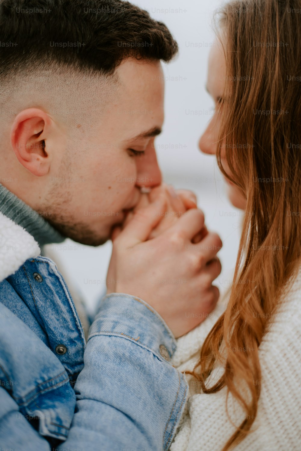 a man and a woman are kissing each other