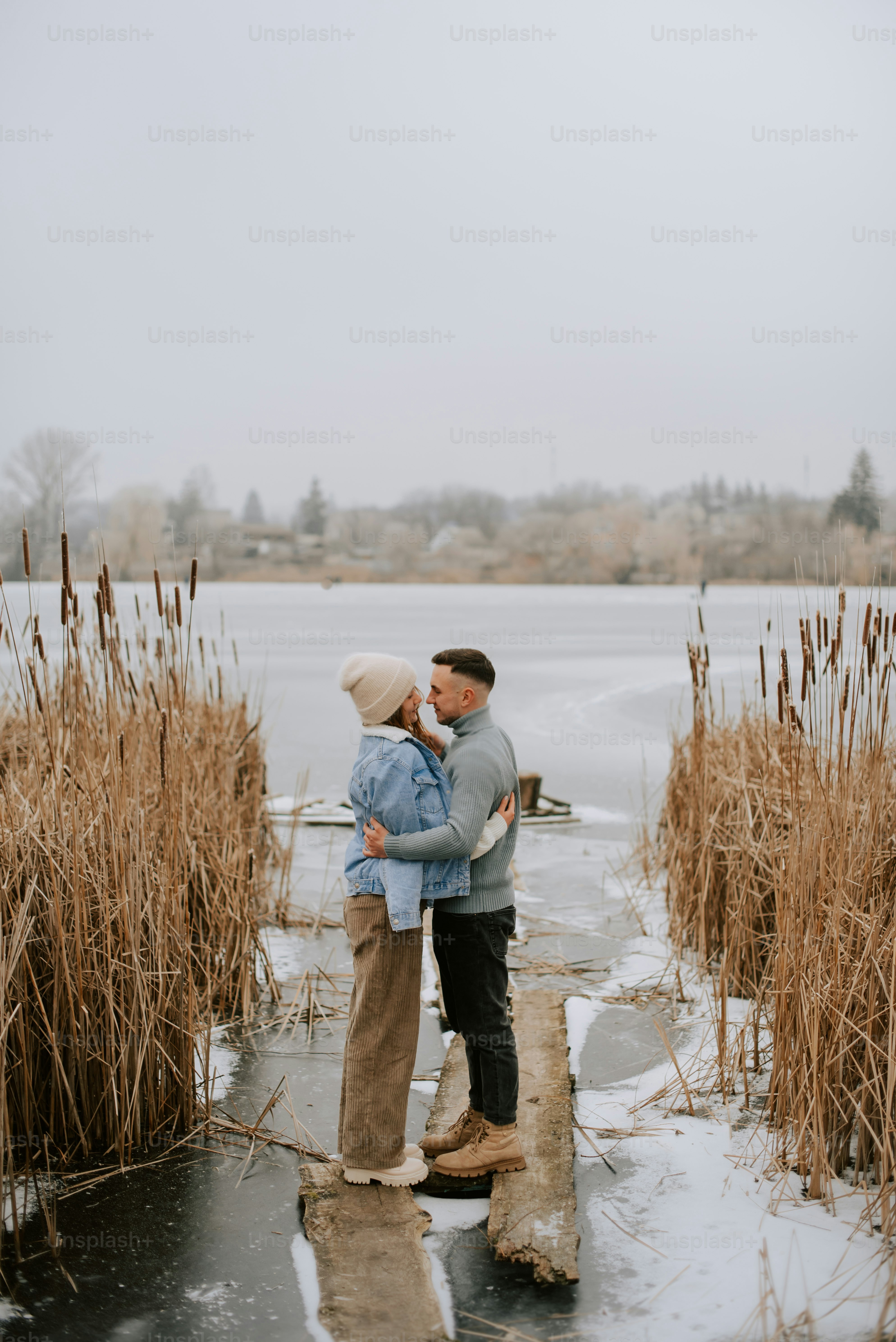 a couple of people that are standing in the water