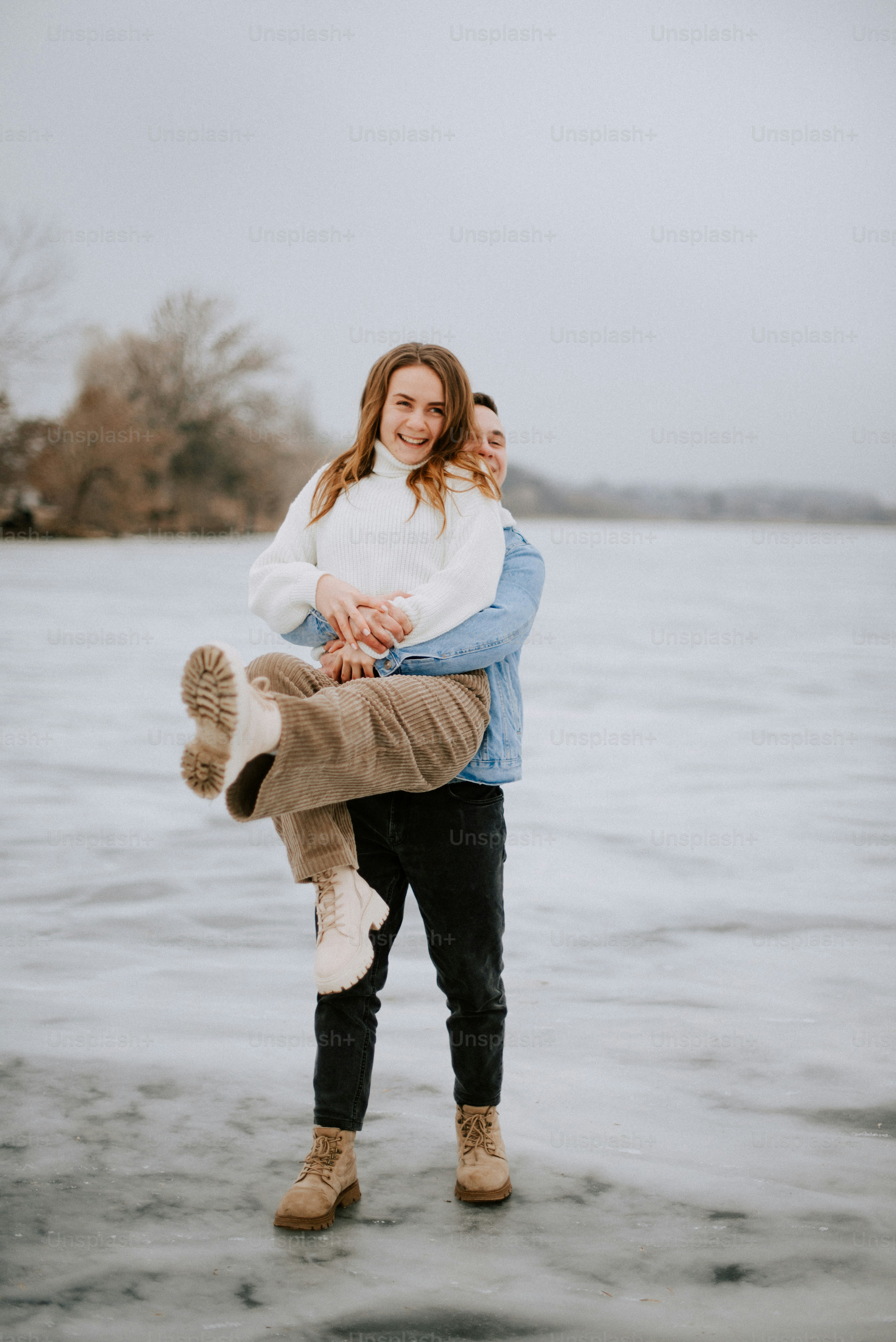 a man carrying a woman on his back
