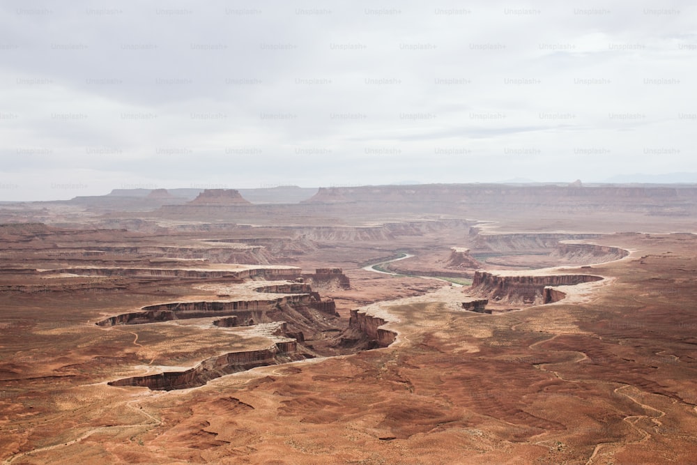 a wide open area with a river running through it