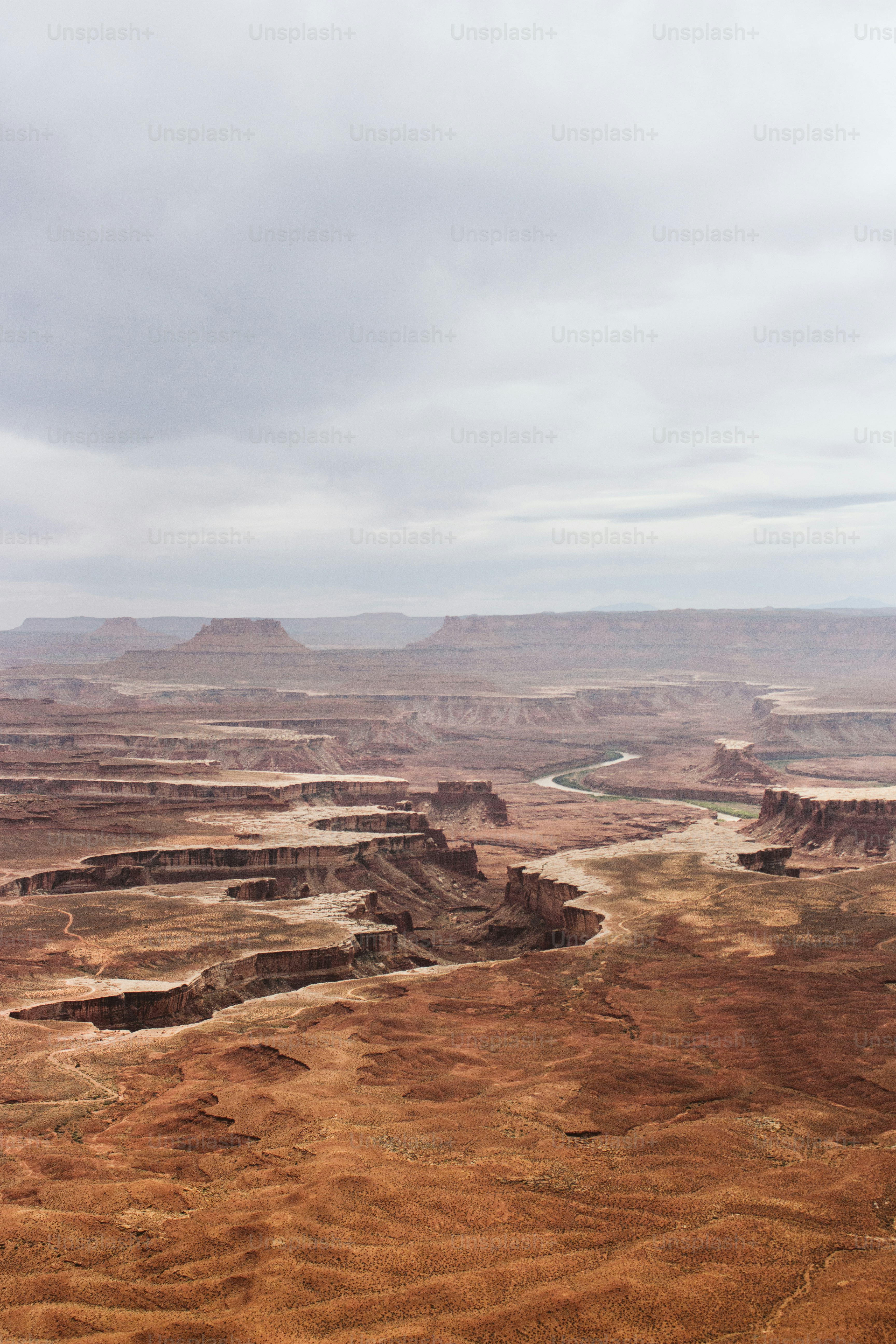 a view of a desert with a river running through it