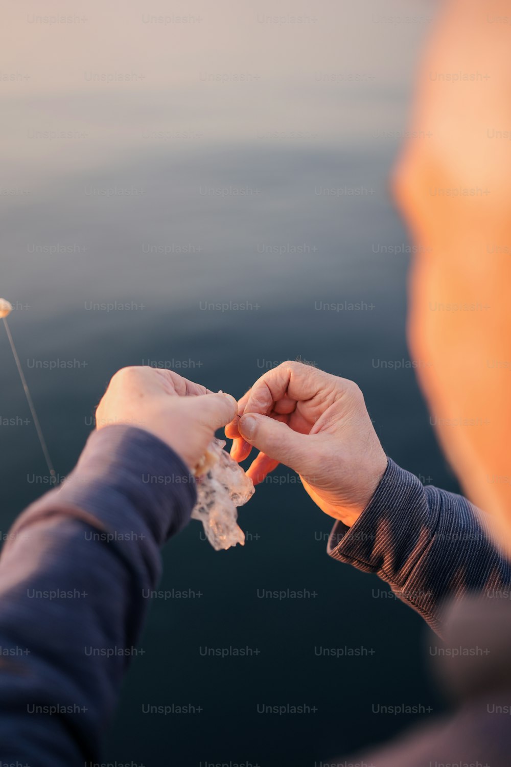 a person holding a piece of food in their hand