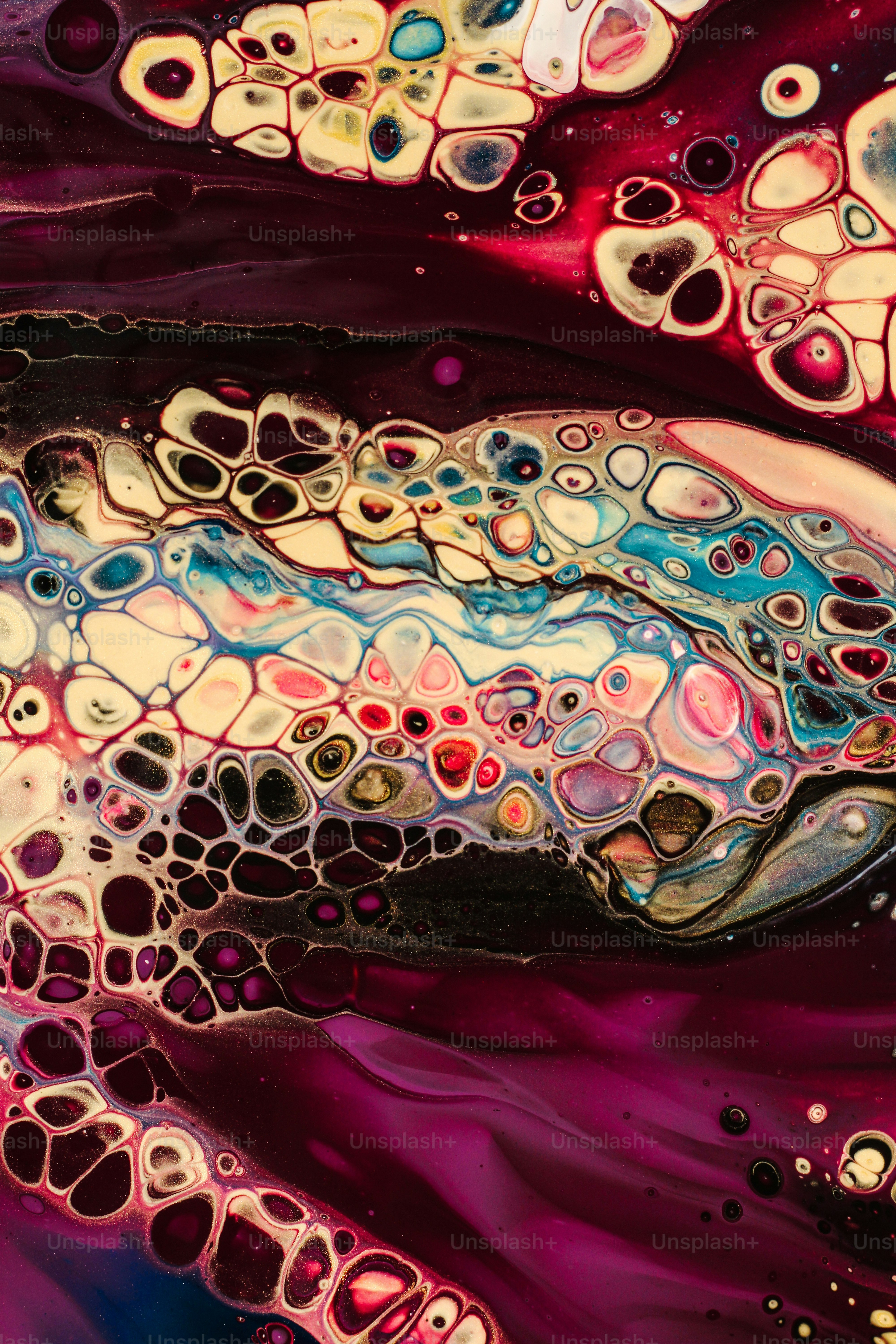 a close up of an abstract painting with lots of colors