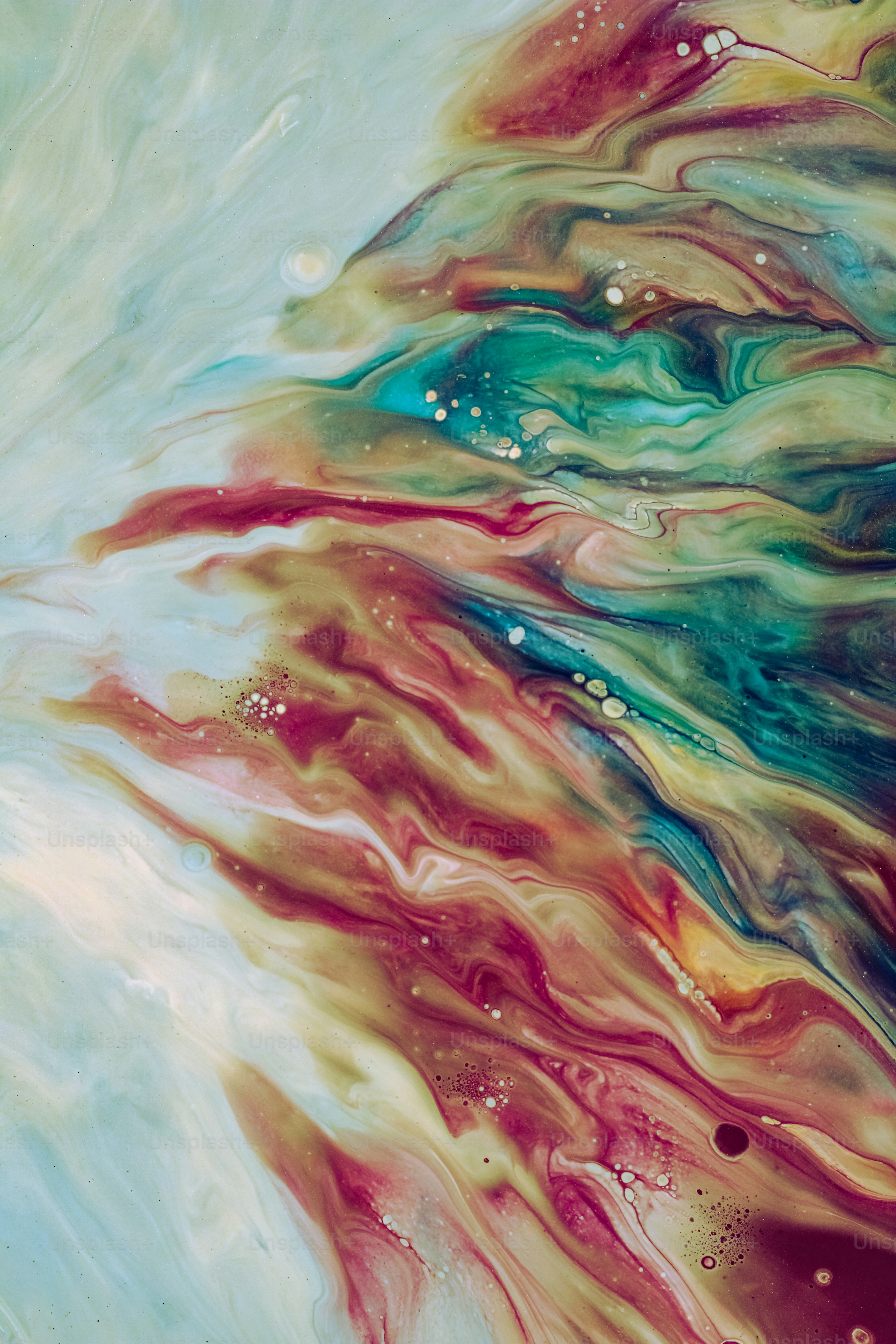 an abstract painting of a blue, red, and green liquid
