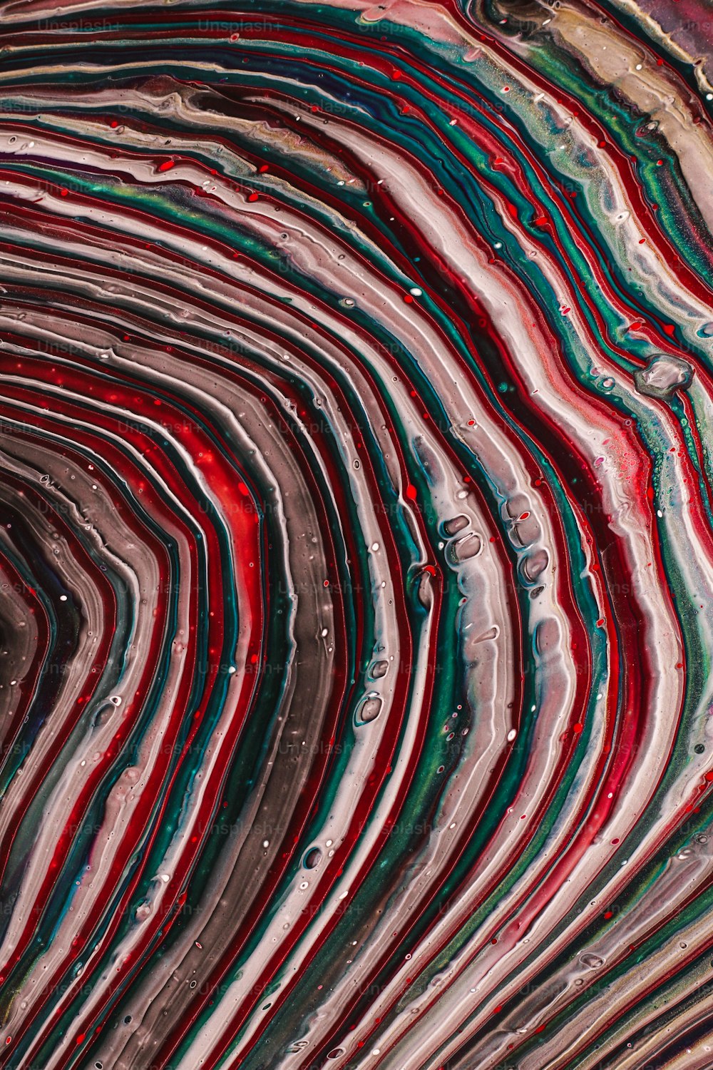 a close up view of a red, green, and blue swirl