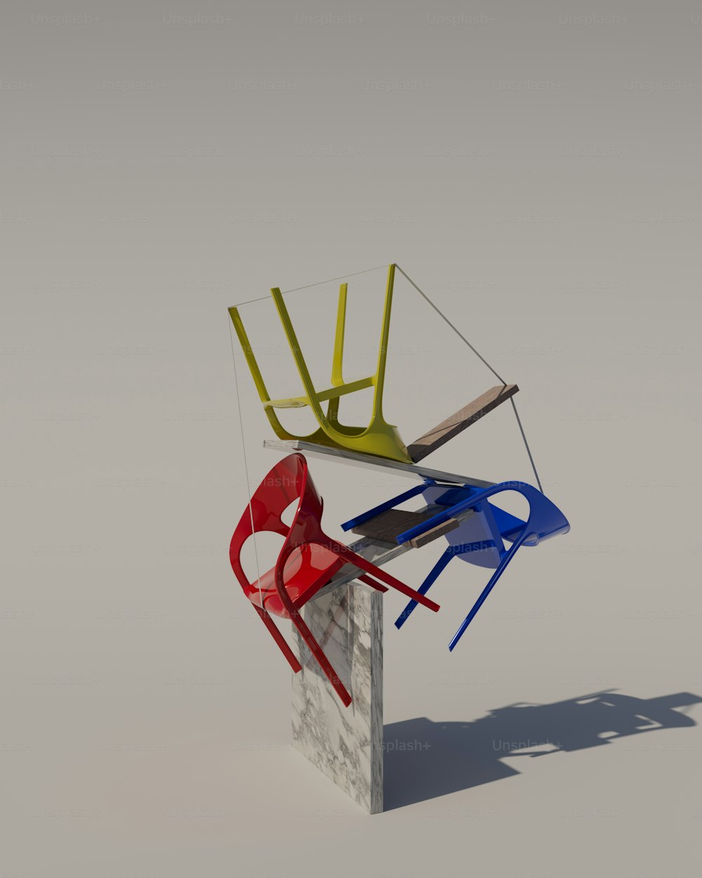 a group of three chairs sitting on top of a cement block
