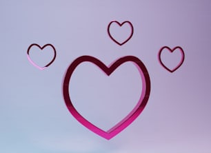 a pink heart with three smaller hearts in the middle