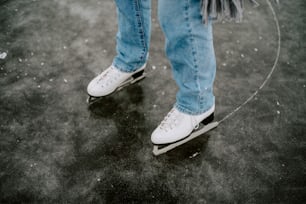 a person riding a skateboard on a wet surface