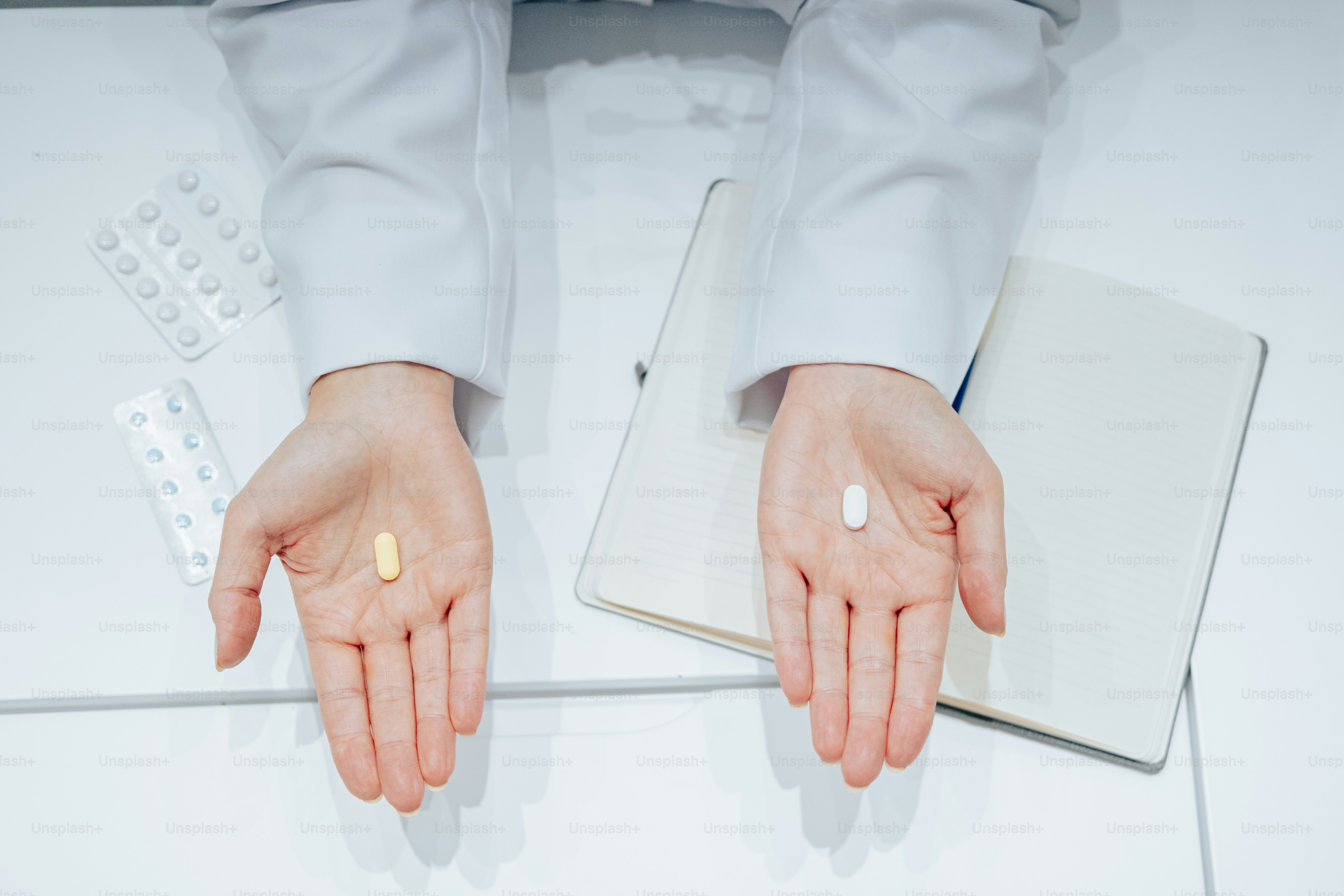 a person in a suit holding out their hands