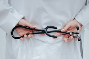 a person holding a pair of scissors in their hands