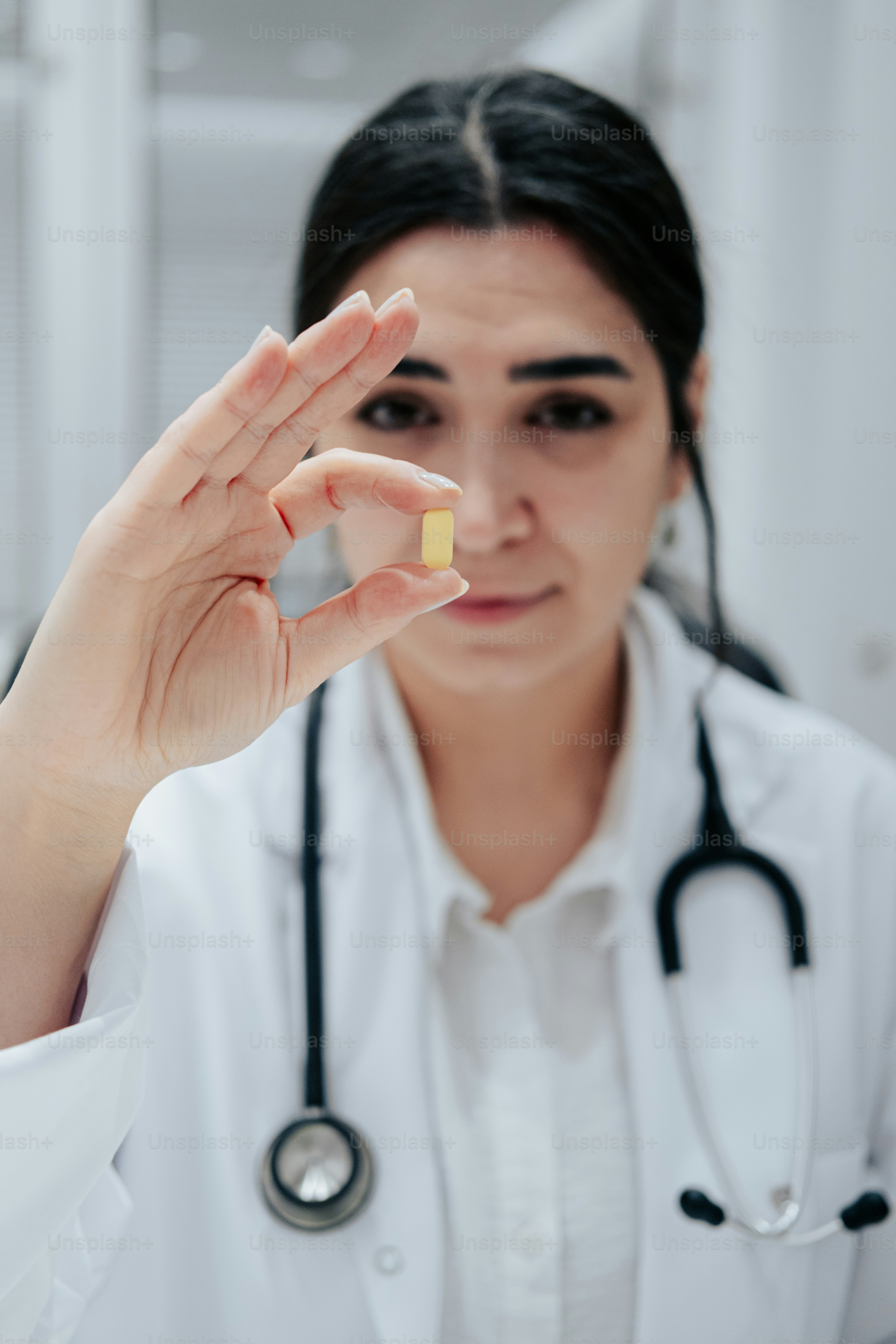 A male doctor in a white coat and white gloves photo Medical Image on
