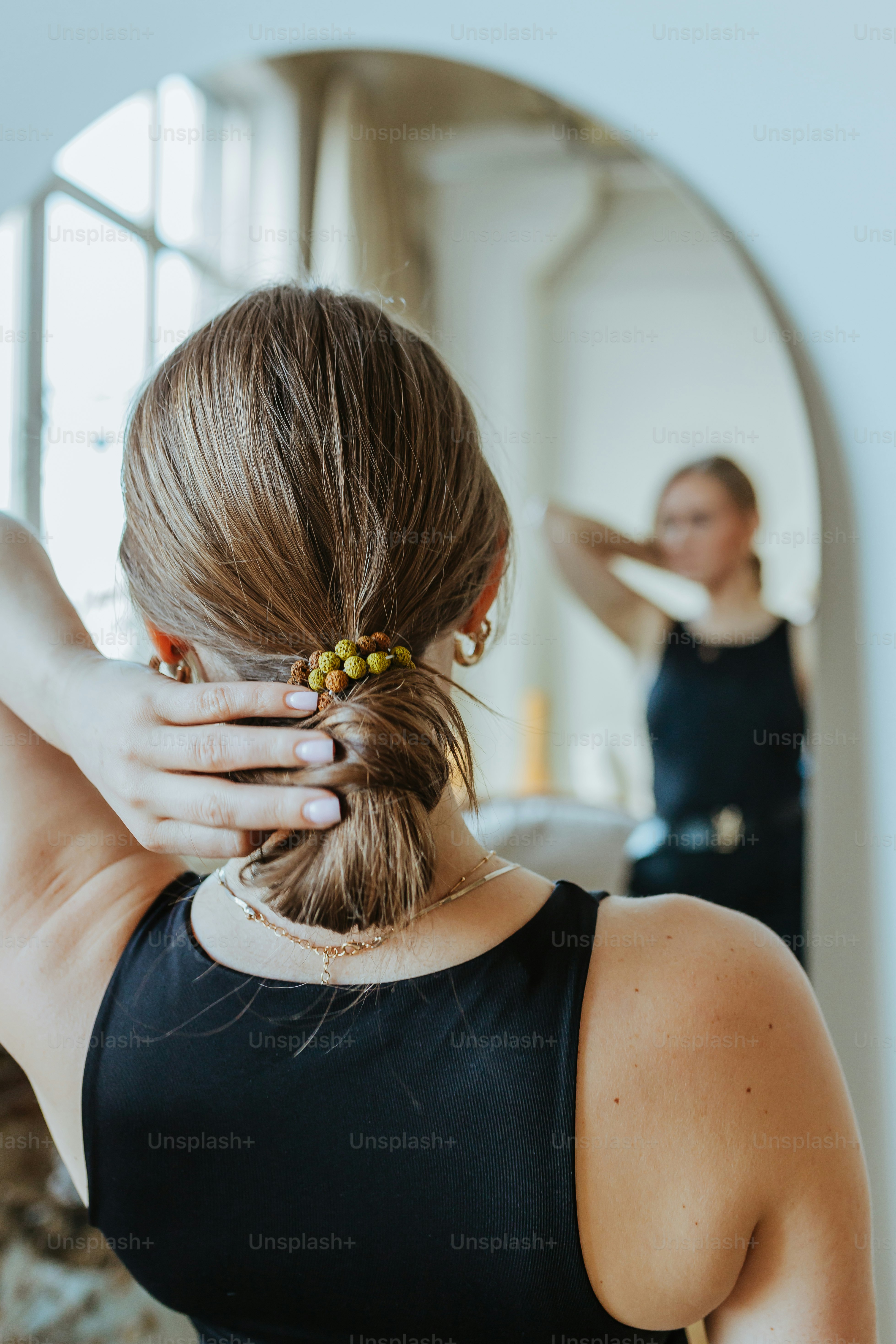 a woman with her hair in a bun