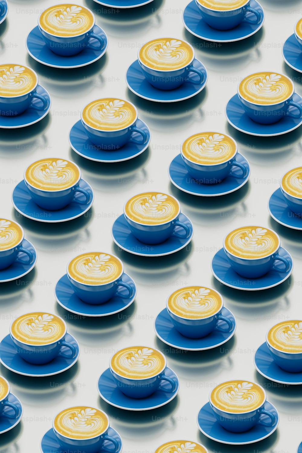a group of blue and yellow cups and saucers