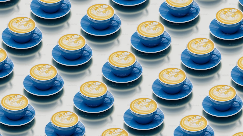 a group of blue and yellow cups and saucers