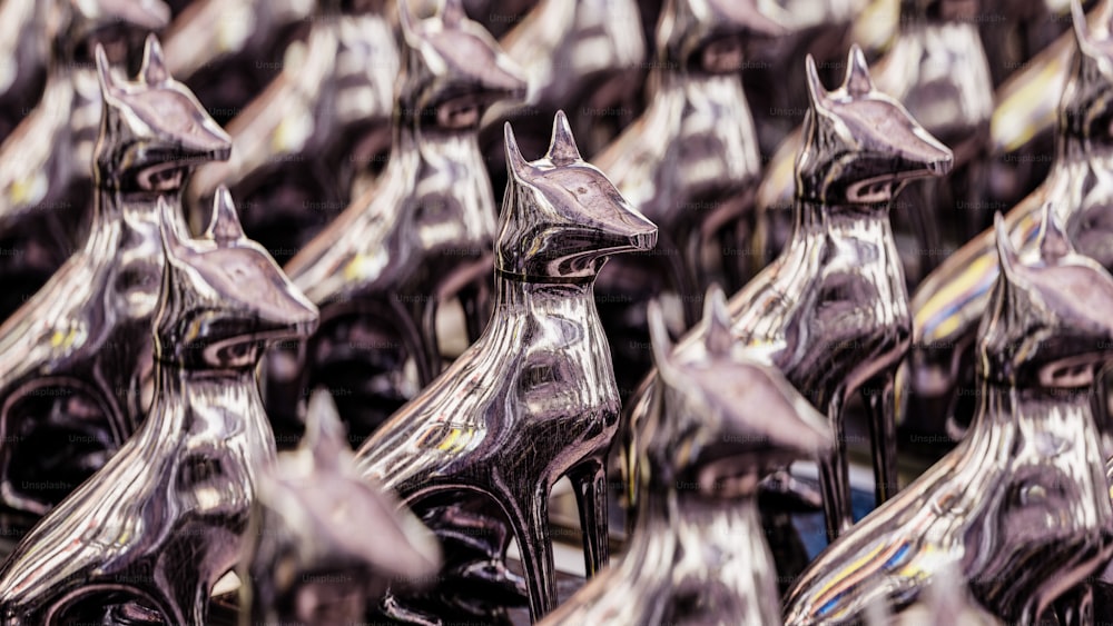 a close up of a group of metal horses
