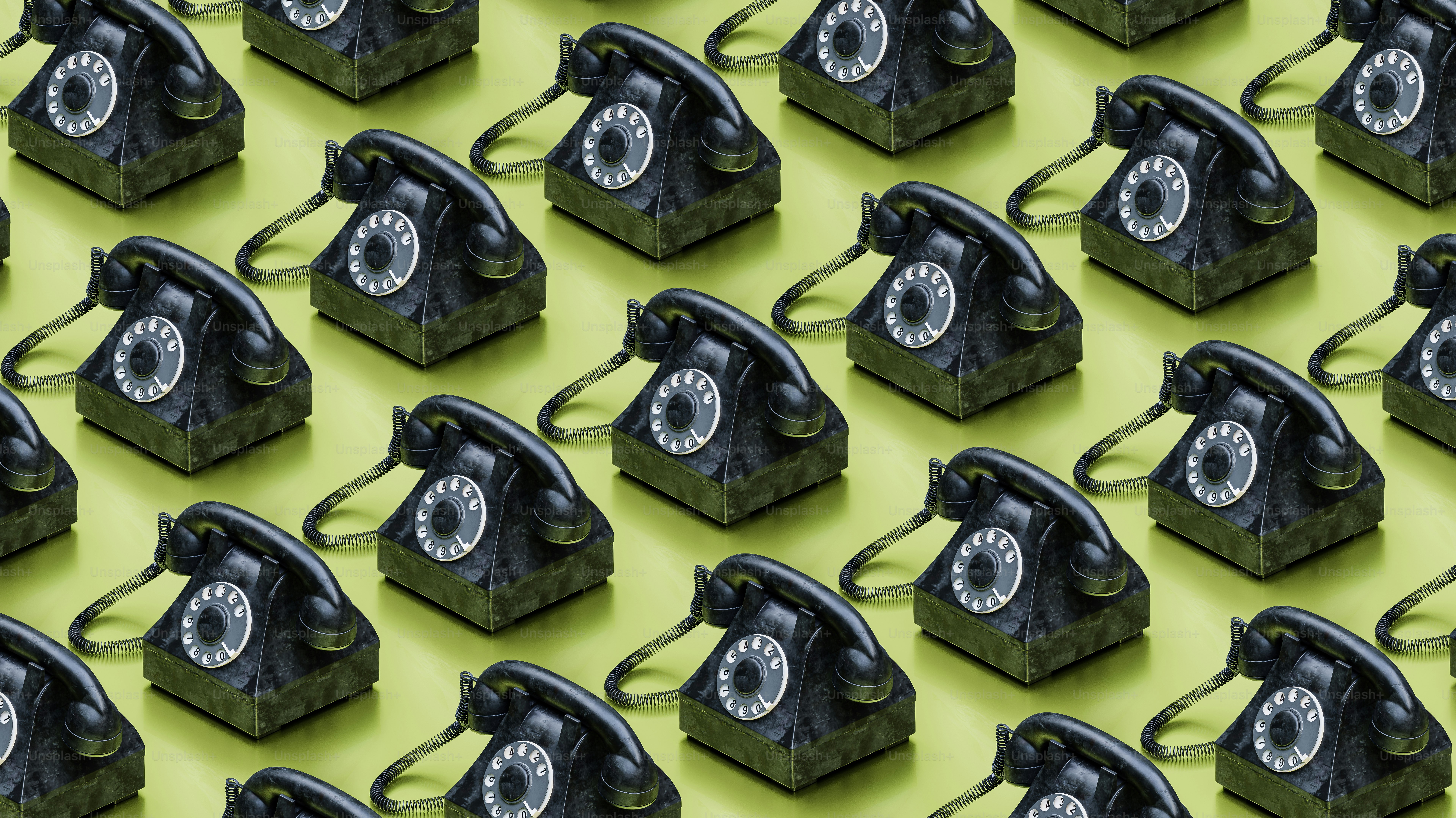 a group of old fashioned telephones sitting next to each other