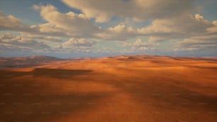 a desert landscape with clouds in the sky