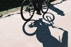 a man riding a bike down a sidewalk