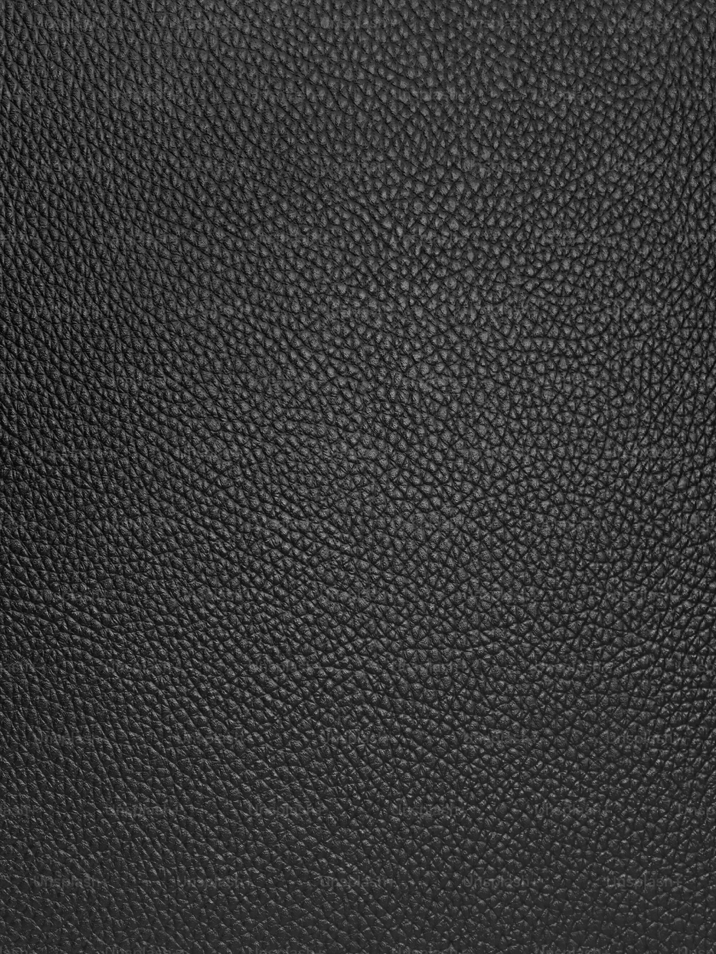 A black leather texture, rendered with Adobe Dimension.