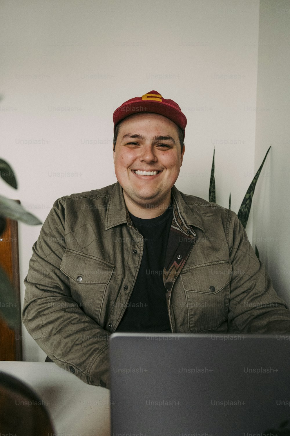 a man sitting in front of a laptop computer