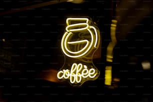 a neon sign that says coffee on it