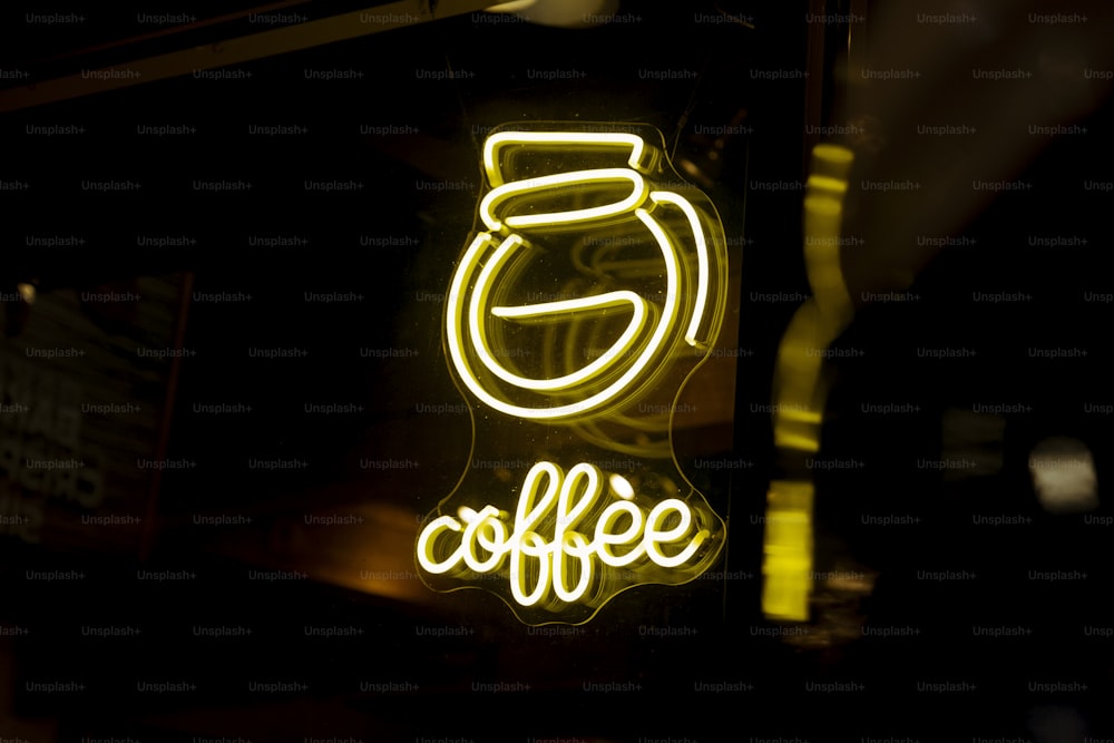 a neon sign that says coffee on it