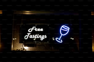 a neon sign with a wine glass on it