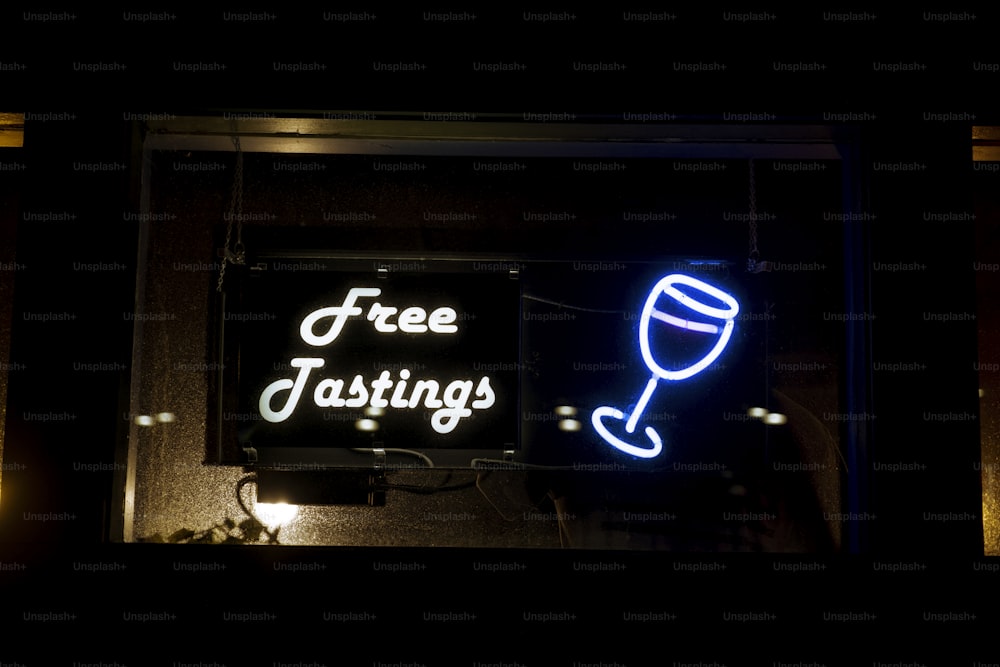 a neon sign with a wine glass on it