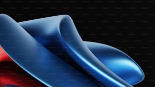 a close up of a blue and red object on a black background
