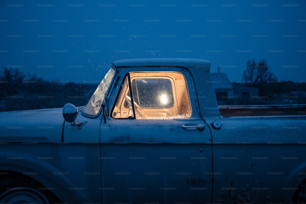 an old truck with a light in the window