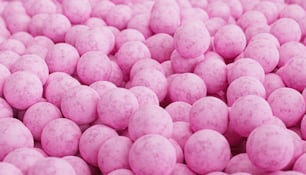 a close up of a bunch of pink candies
