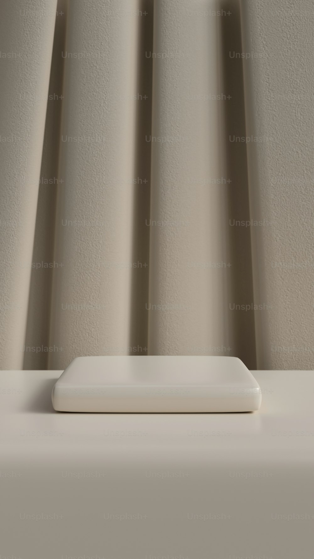 a white square object sitting on top of a table