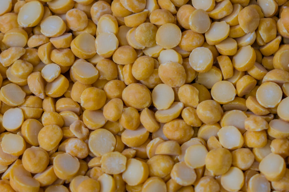 a close up of a pile of yellow beans