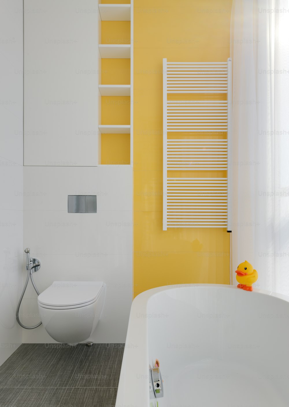 a bathroom with a toilet and a bathtub