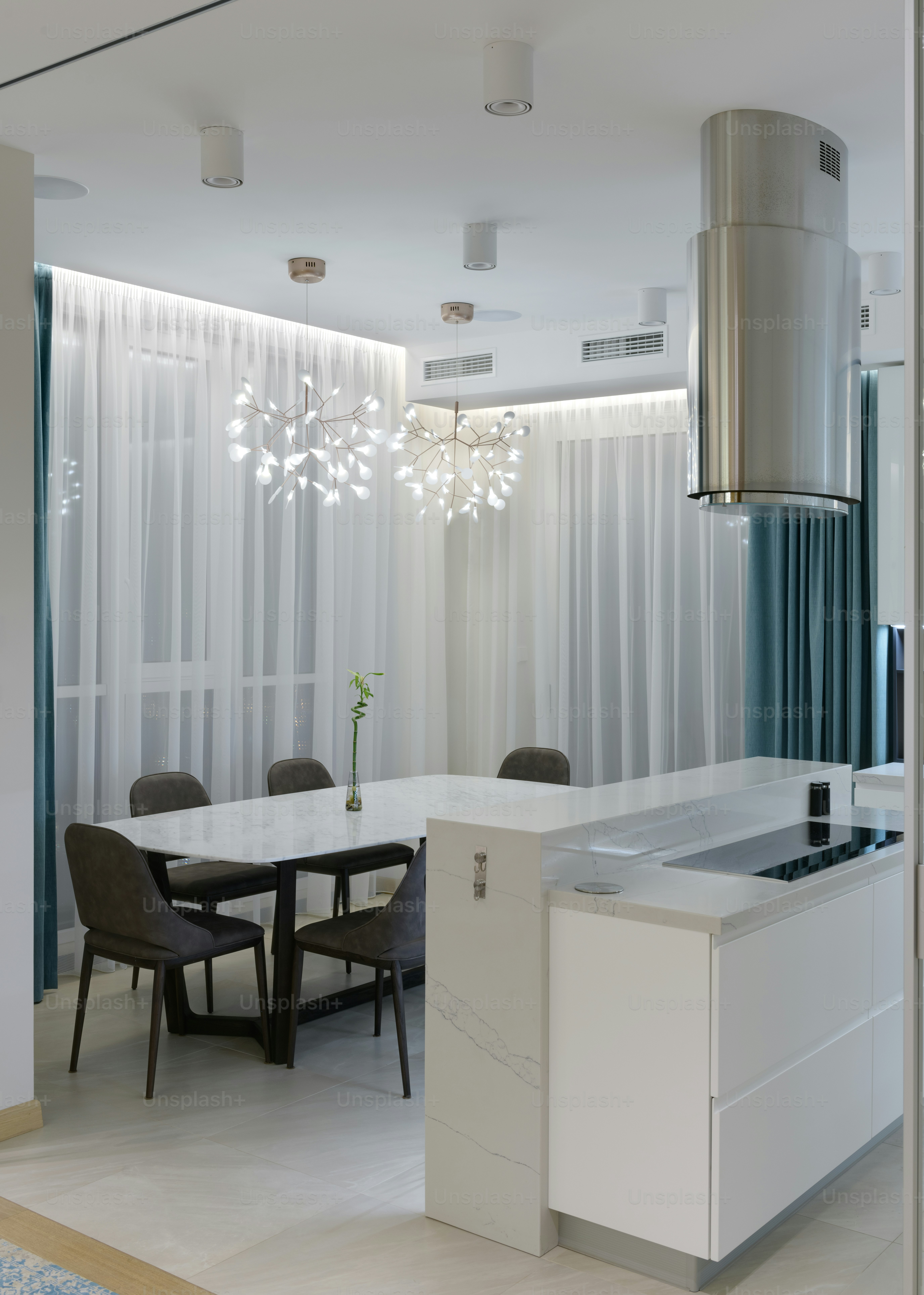 a dining room with a table and chairs