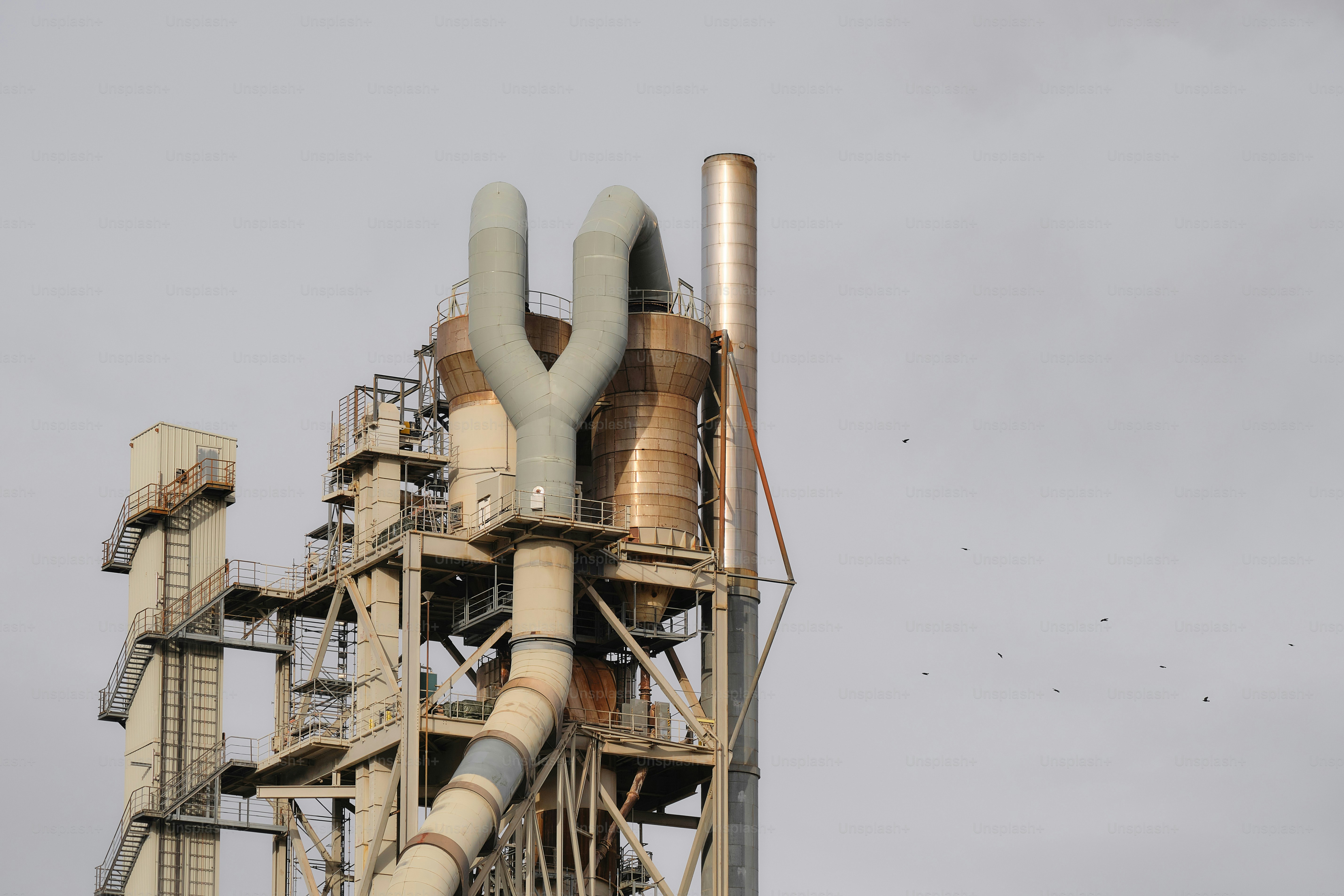 A large metal pipe sticking out of the side of a building photo