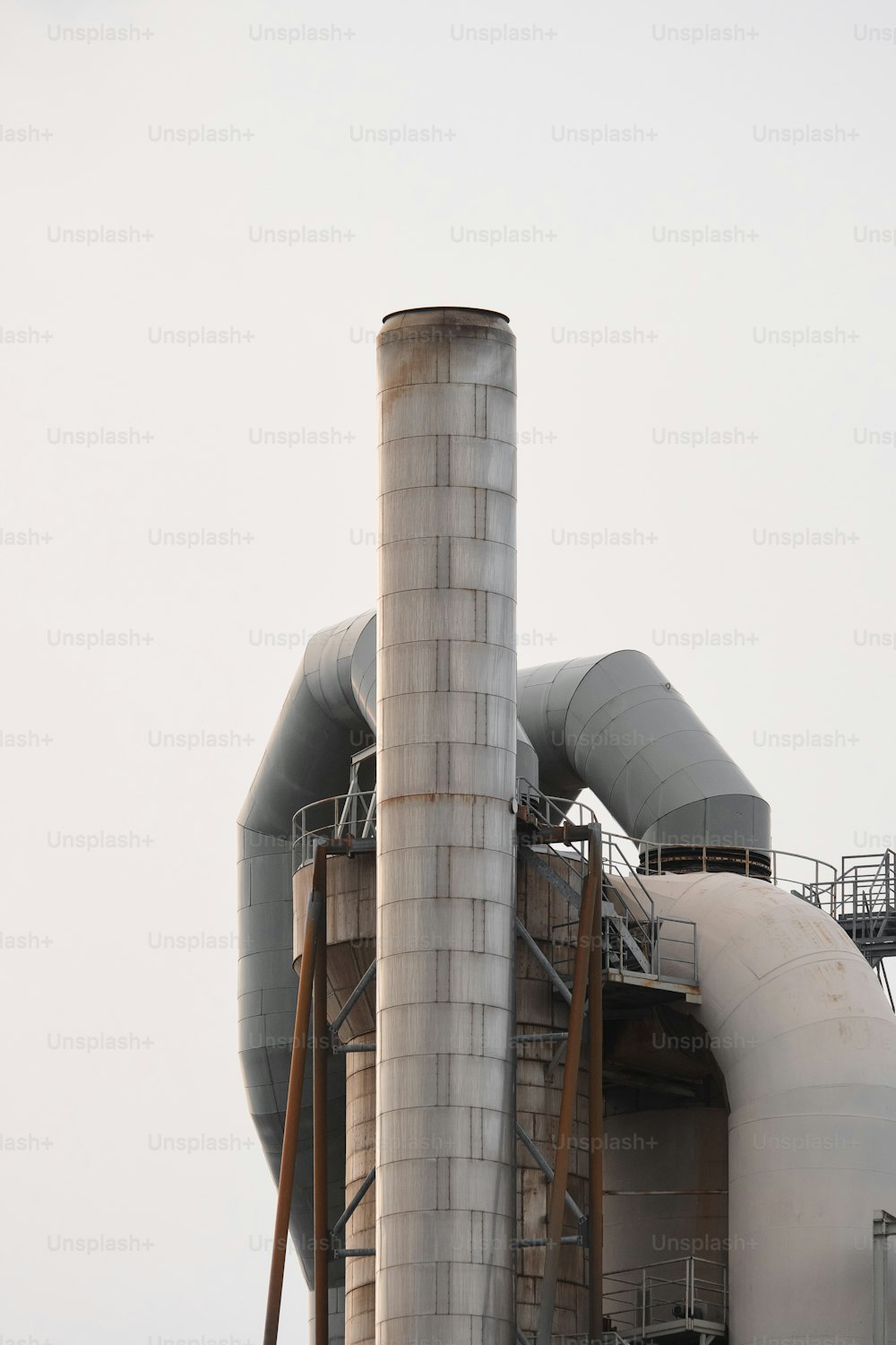 a large industrial building with a lot of pipes