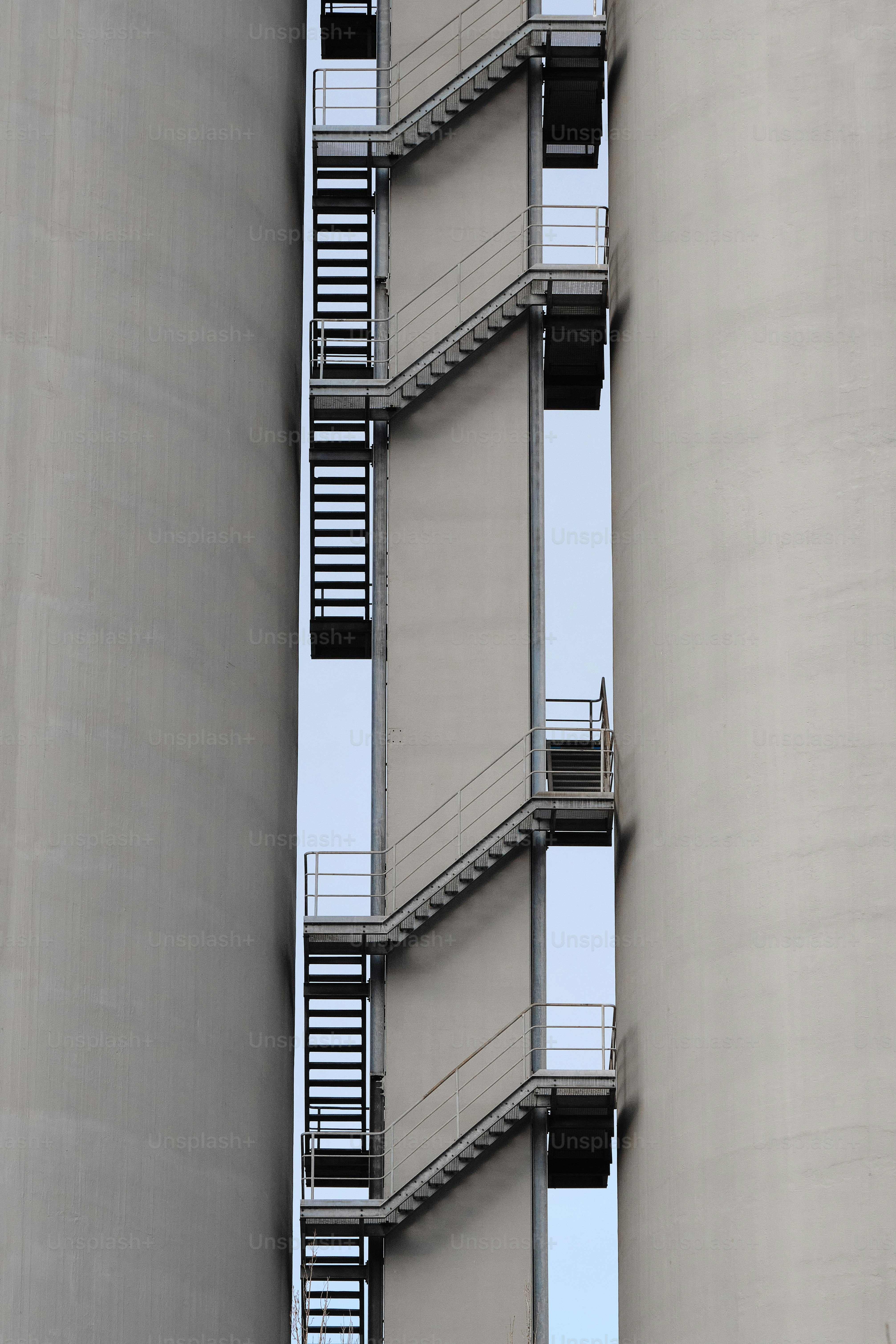 a tall building with a bunch of balconies next to it