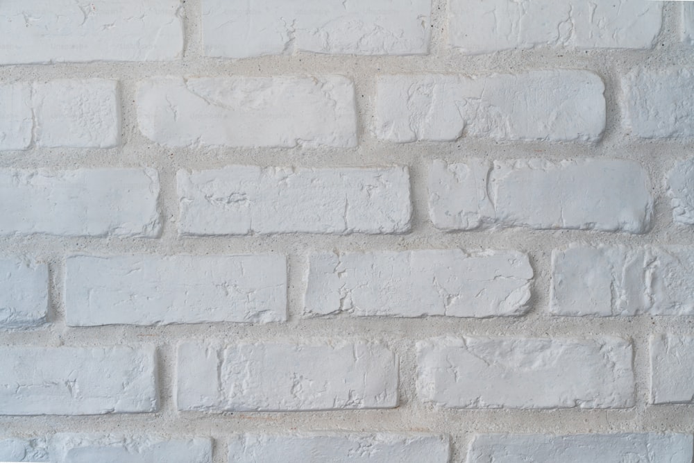 a close up of a white brick wall