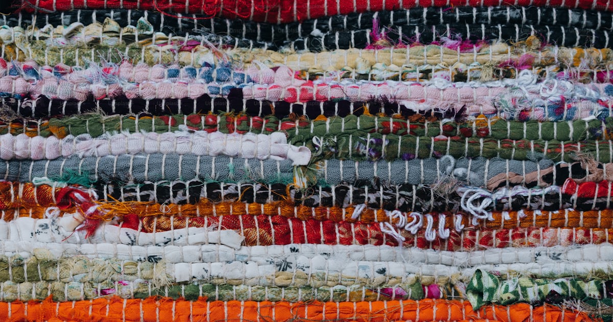A close up of a multi colored rug photo – Texture Image on Unsplash