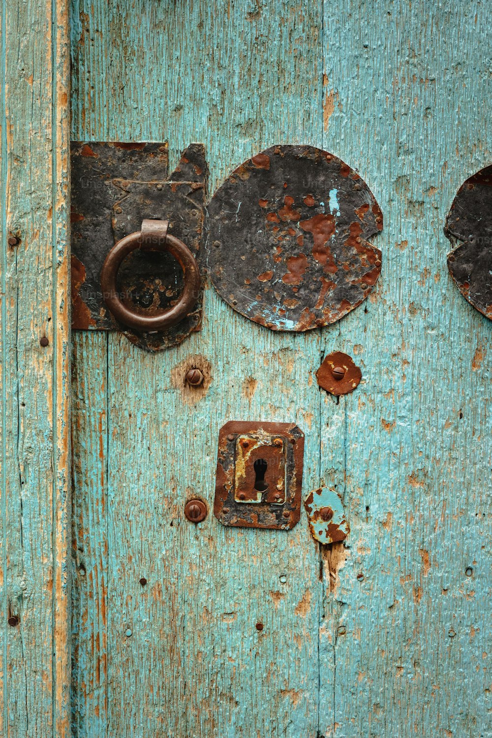 a close up of a door with a bunch of knobs on it
