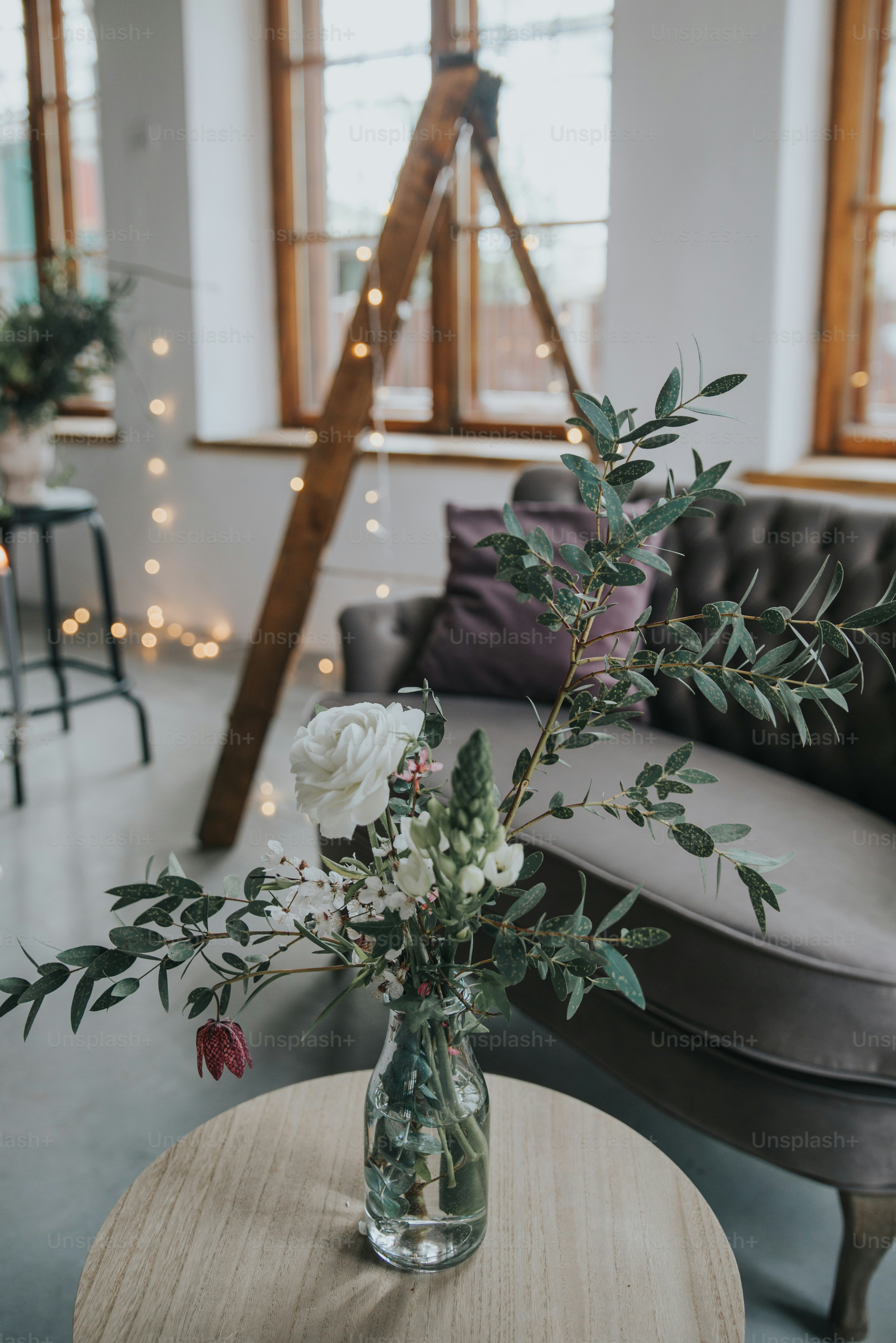 a vase with flowers on a table in a room