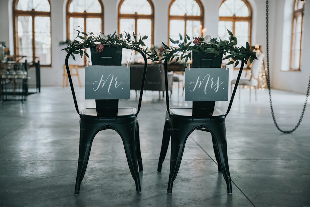 a couple of chairs that have signs on them