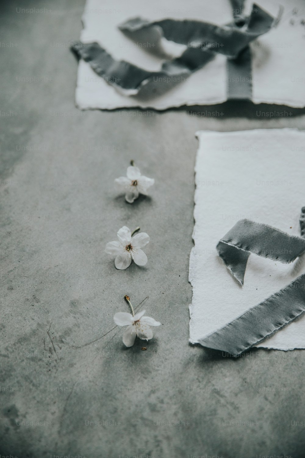 a pair of scissors and some flowers on a table