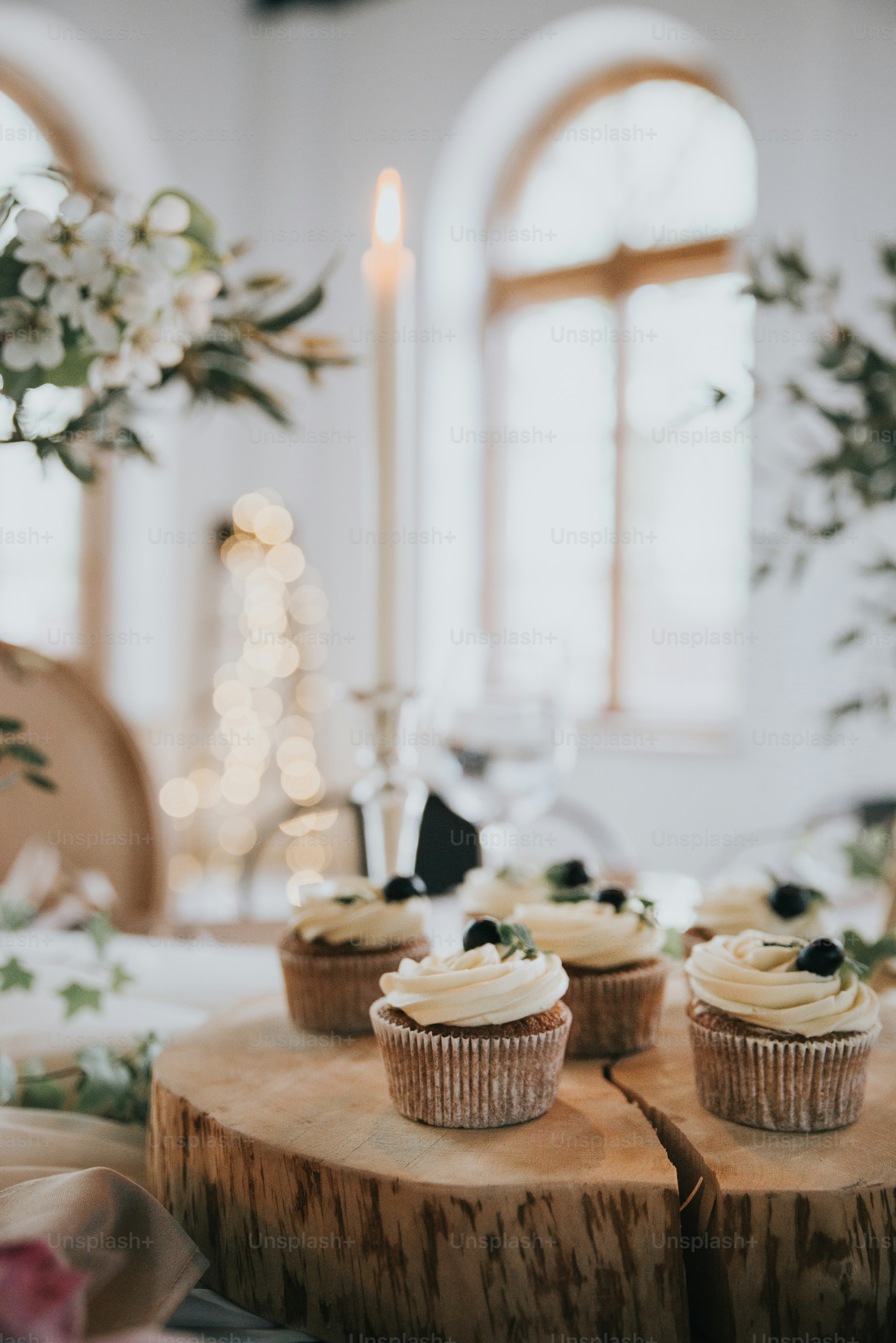 three cupcakes sitting on top of a wooden table