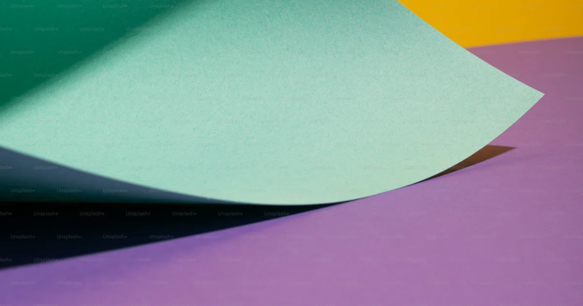 A close up of a folded piece of paper photo – Folded paper Image on ...