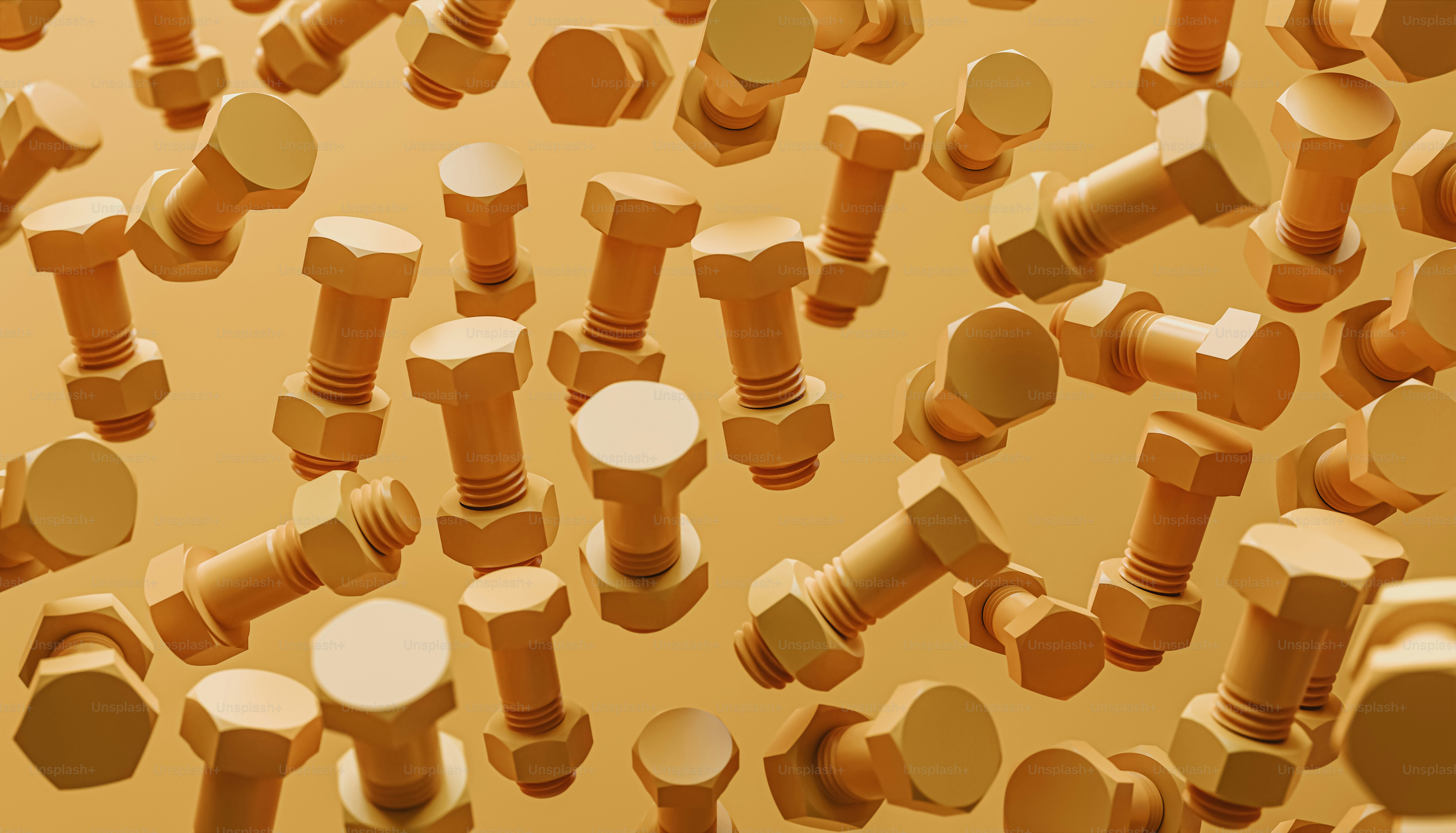 beaucoup de vis et d’écrous sur fond jaune