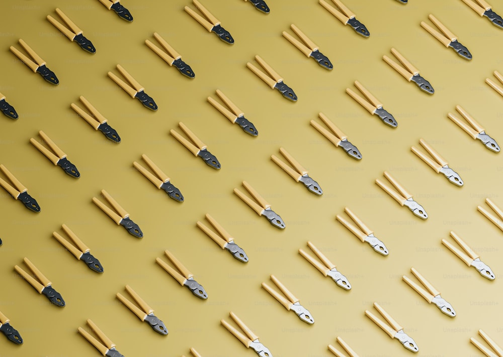 a yellow background with a bunch of metal objects on it
